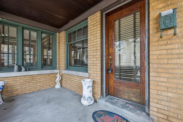 a view of front door of house with wooden floor