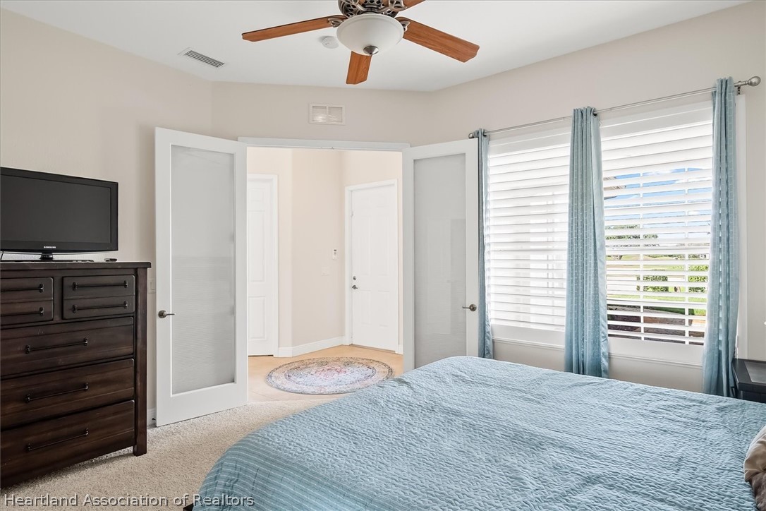 5224 Haw Branch Road Sebring, FL 33875 - Photo 26 of 40 a bedroom with a bed and furniture