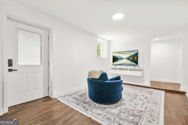 a living room with furniture and a rug