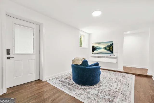 a living room with furniture and a rug