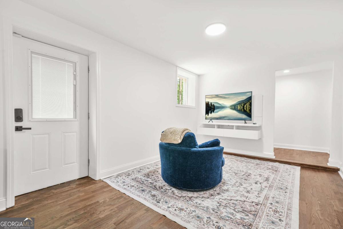2430 Hanford Drive Southwest Atlanta, GA 30315 - Photo 11 of 21 a living room with furniture and a rug