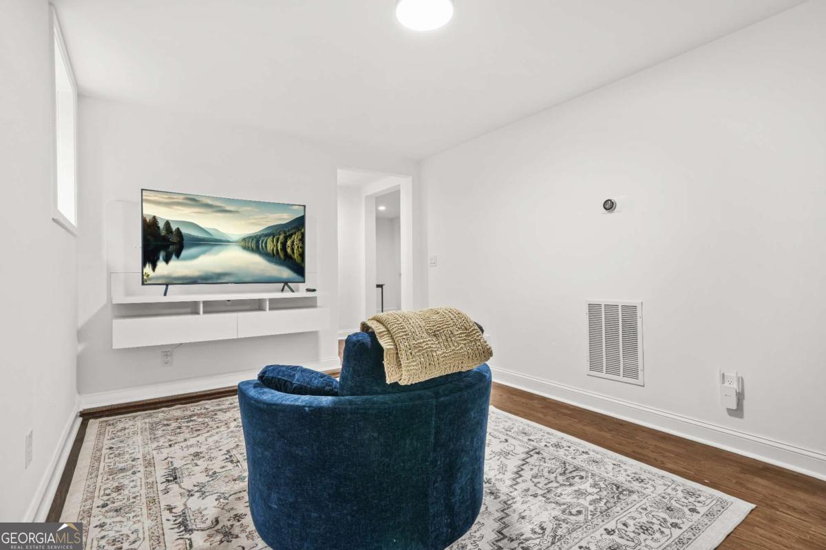 2430 Hanford Drive Southwest Atlanta, GA 30315 - Photo 12 of 21 a living room with furniture and a rug