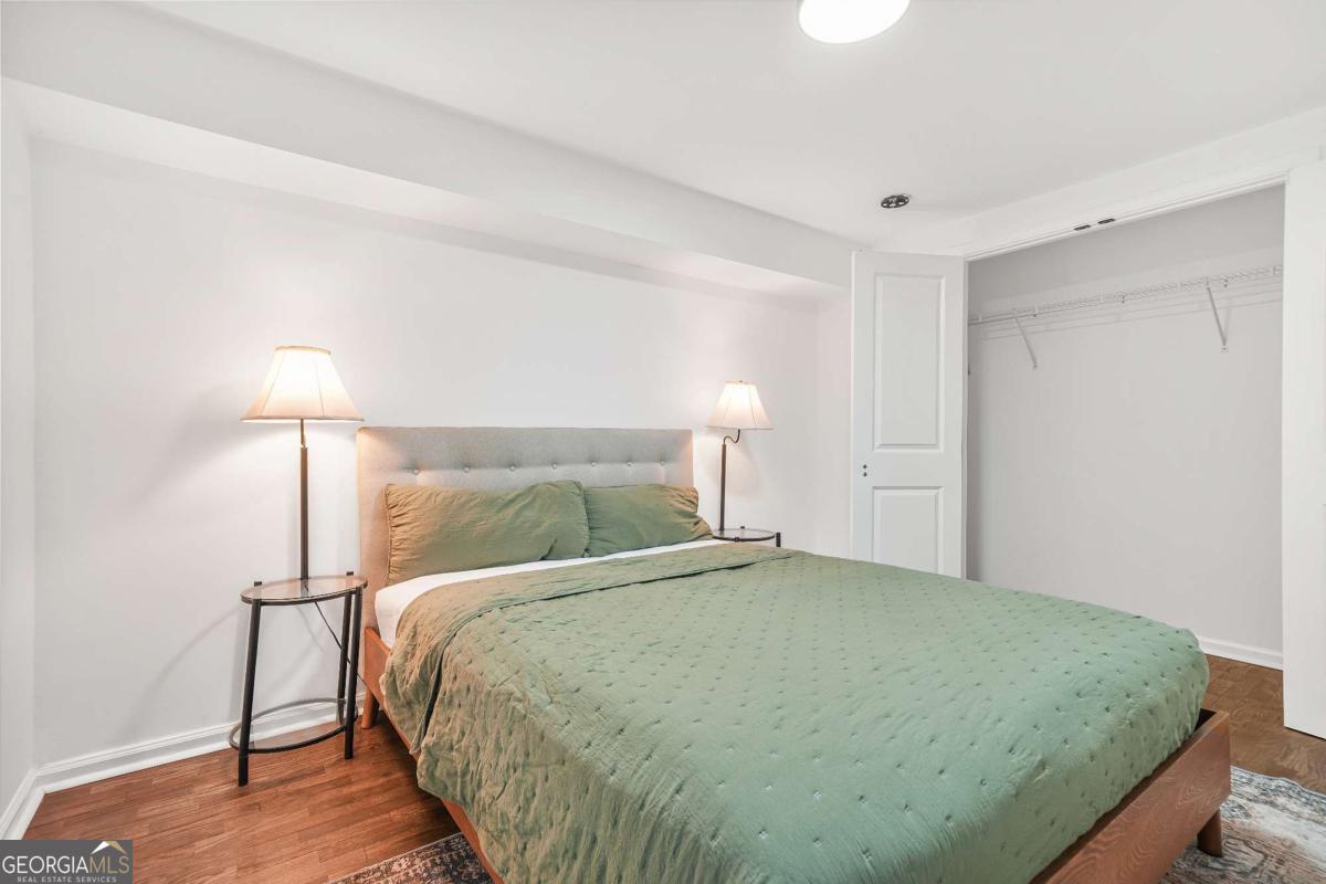 2430 Hanford Drive Southwest Atlanta, GA 30315 - Photo 16 of 21 a bedroom with a bed and a night stand