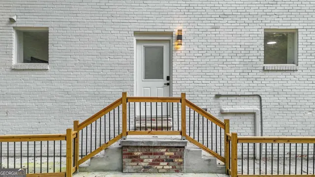 a view of a brick house with a window