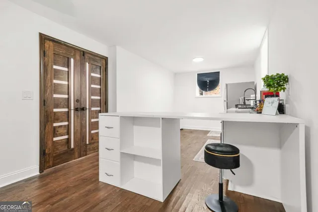 a kitchen with a refrigerator and a stove