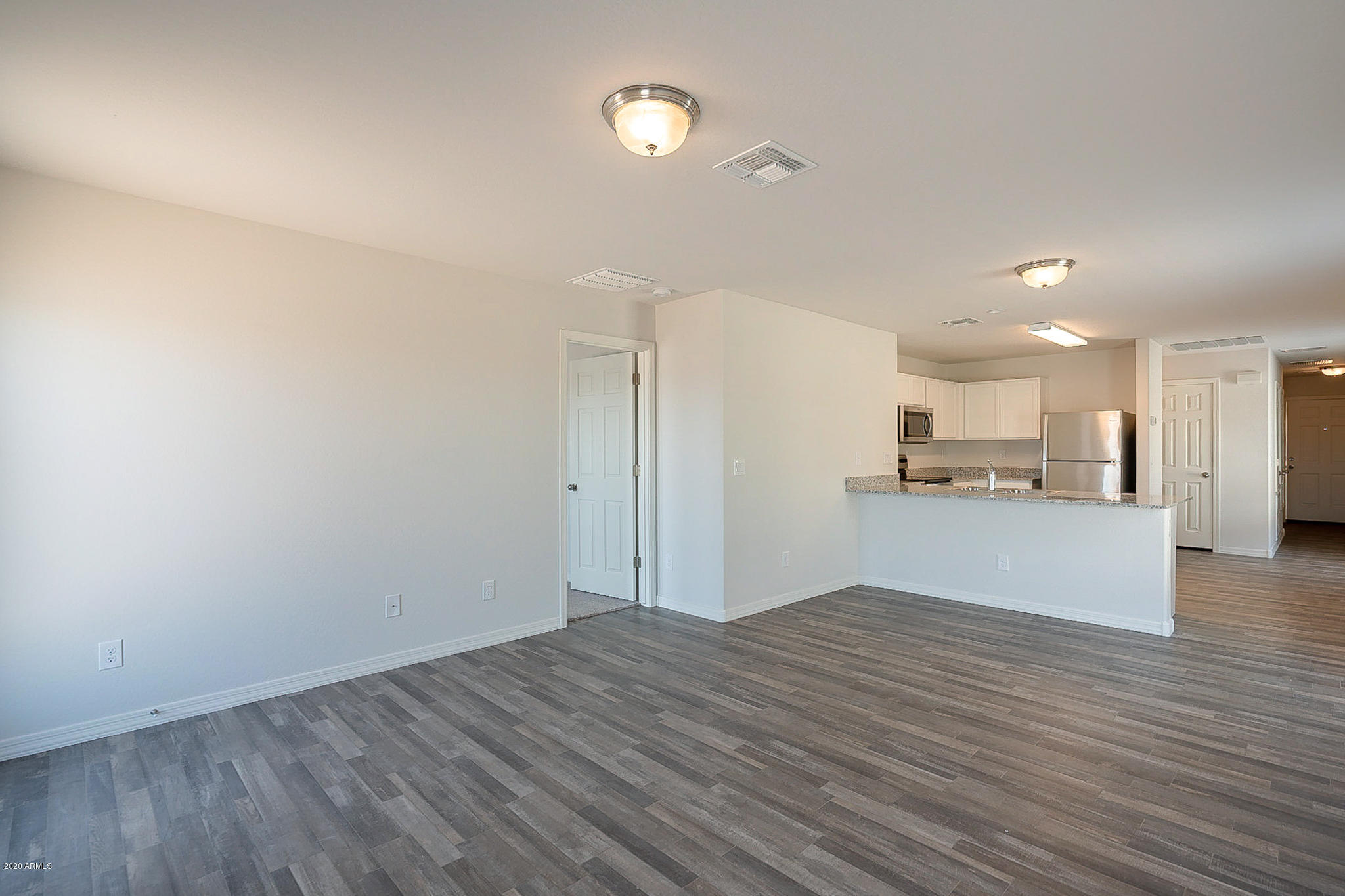 944 Starview Avenue Coolidge, AZ 85128 - Photo 12 of 36 a view of kitchen cabinet and microwave