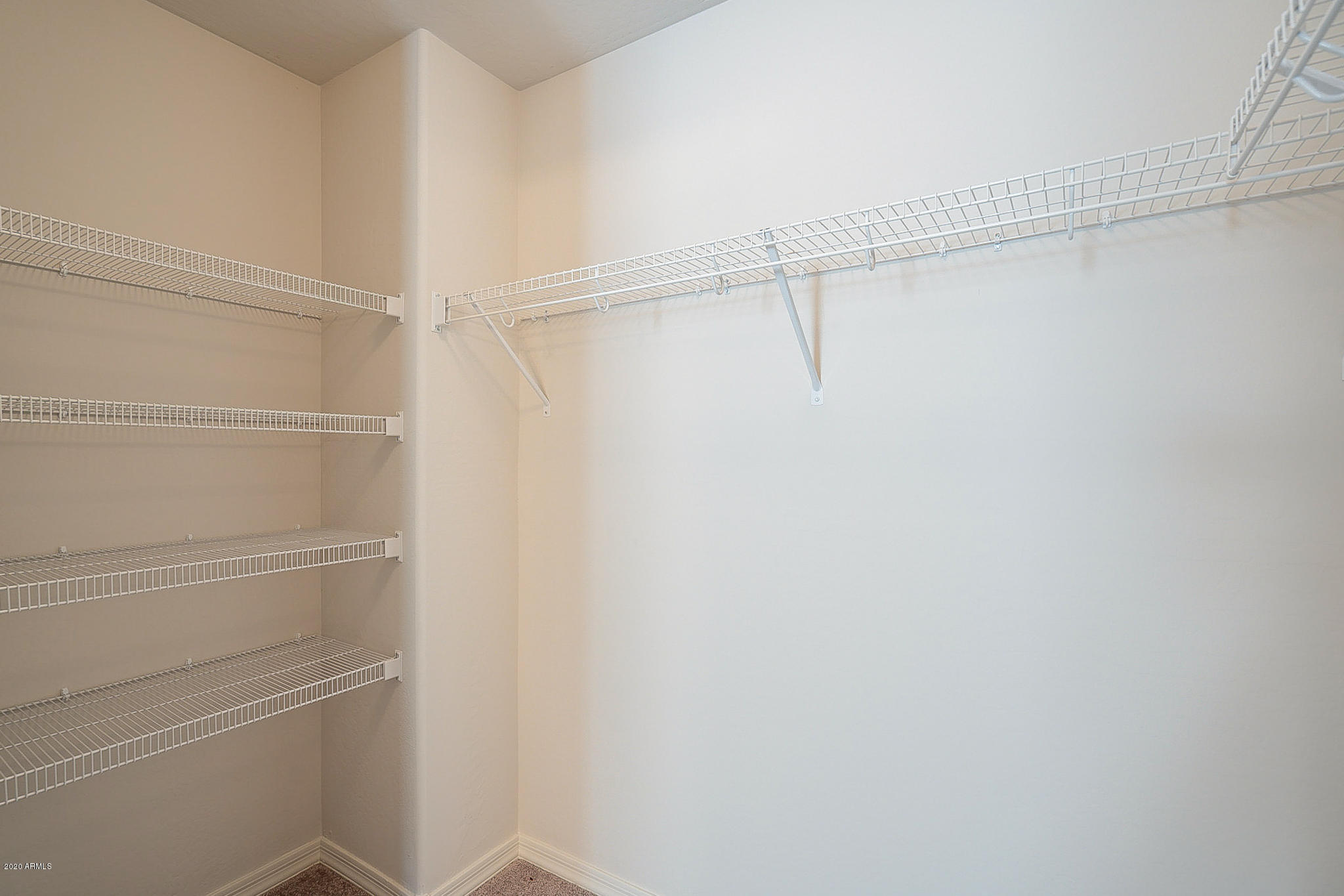 944 Starview Avenue Coolidge, AZ 85128 - Photo 21 of 36 a view of an empty walk in closet