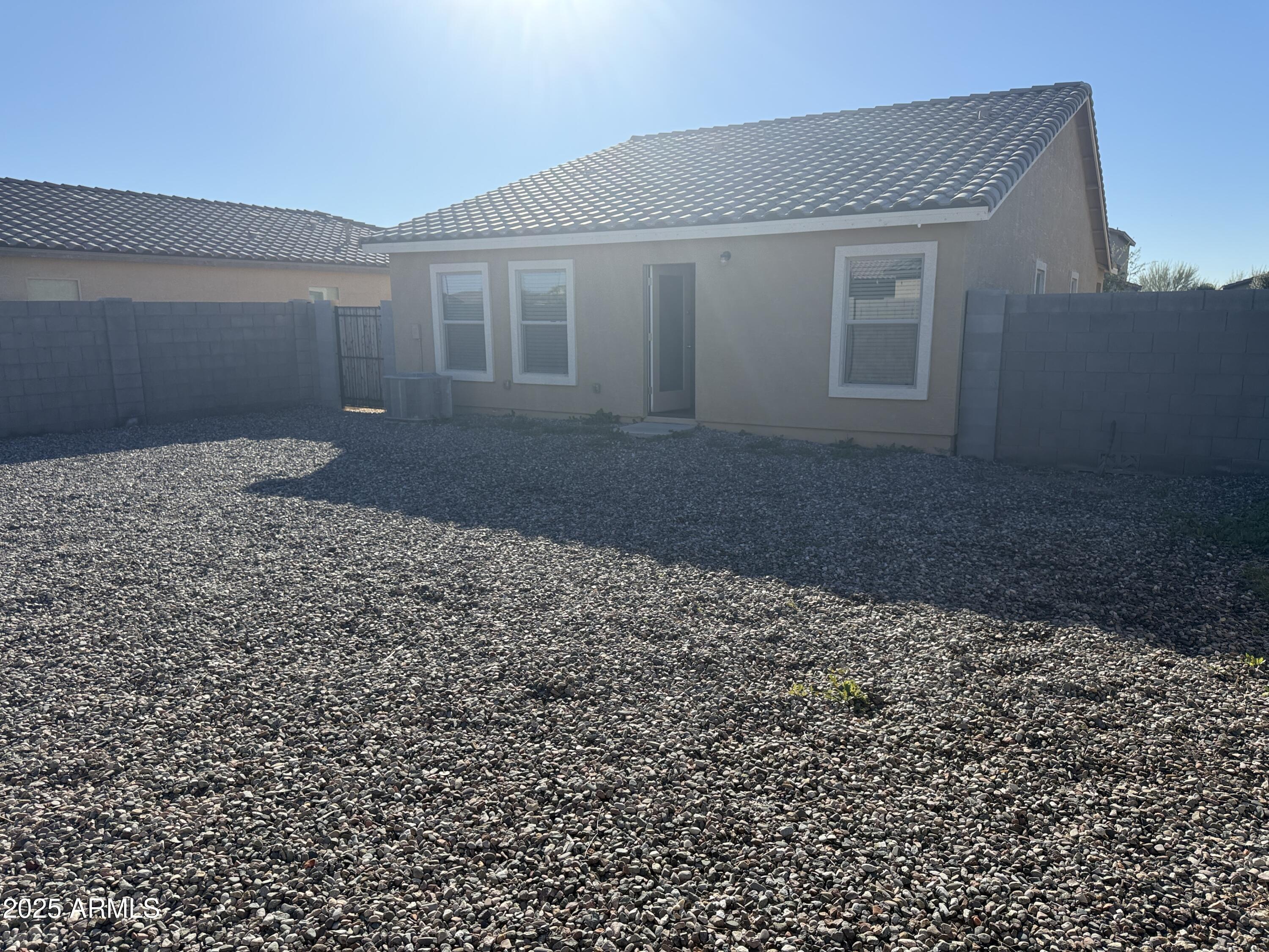 944 Starview Avenue Coolidge, AZ 85128 - Photo 28 of 36 a front view of a house with a yard