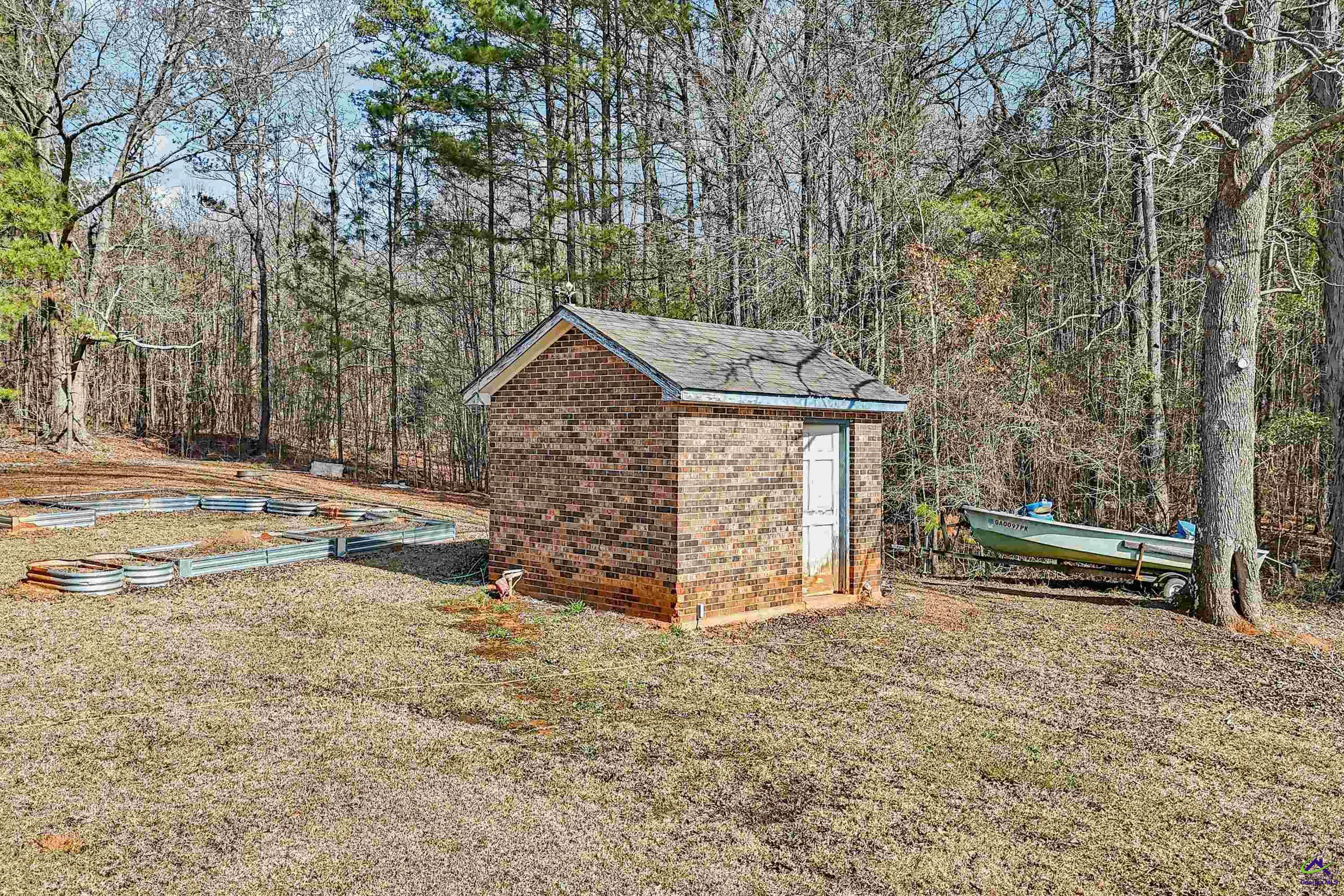 548 Greene Settlement Road Gray, GA 31032 - Photo 57 of 68 a view of a house with a yard and wooden fence