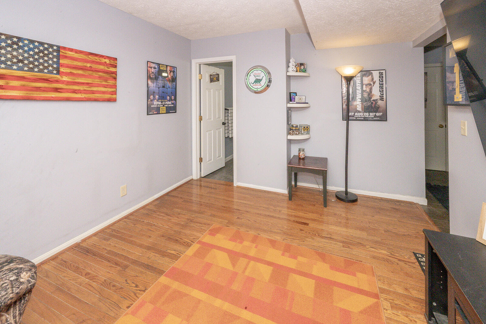 29 School Road Walton, KY 41094 - Photo 8 of 30 Wood-finish flooring throughout, complemented by light grey wall paint and white baseboards