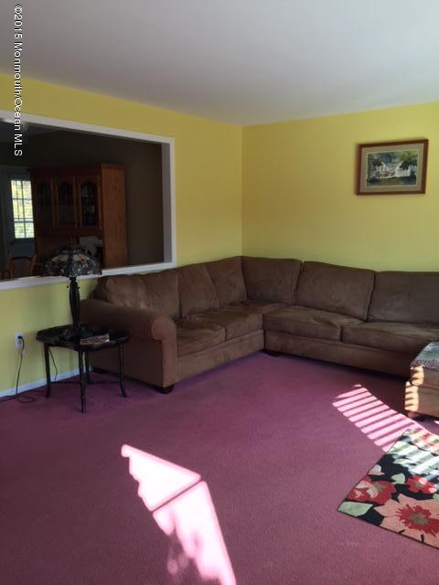 454 Freehold Road Jackson, NJ 08527 - Photo 12 of 18 a living room with furniture and a couch