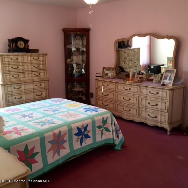 454 Freehold Road Jackson, NJ 08527 - Photo 15 of 18 a bedroom with a bed and dresser