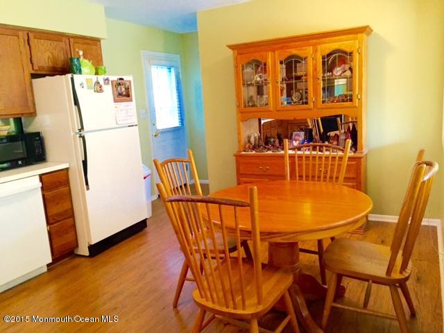 454 Freehold Road Jackson, NJ 08527 - Photo 6 of 18 a outdoor dining space with furniture and wooden floor