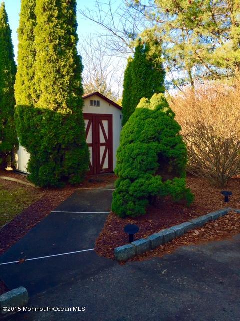 454 Freehold Road Jackson, NJ 08527 - Photo 10 of 18 a sign board with yard