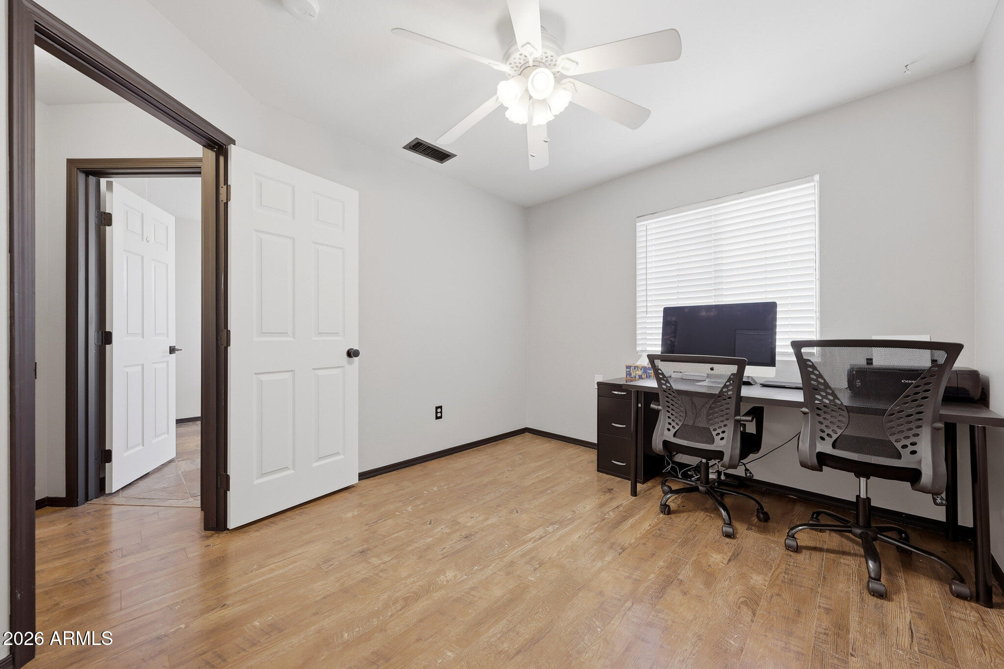 2167 East Nighthawk Way Phoenix, AZ 85048 - Photo 23 of 28 a view of a workspace with furniture and a window