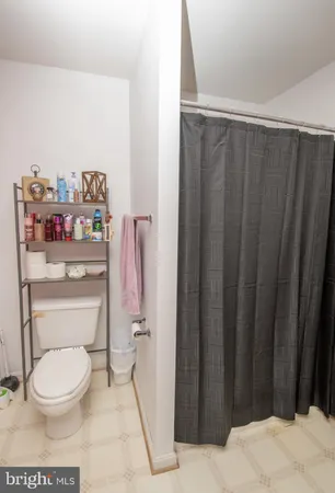 a bathroom with a toilet and a vanity