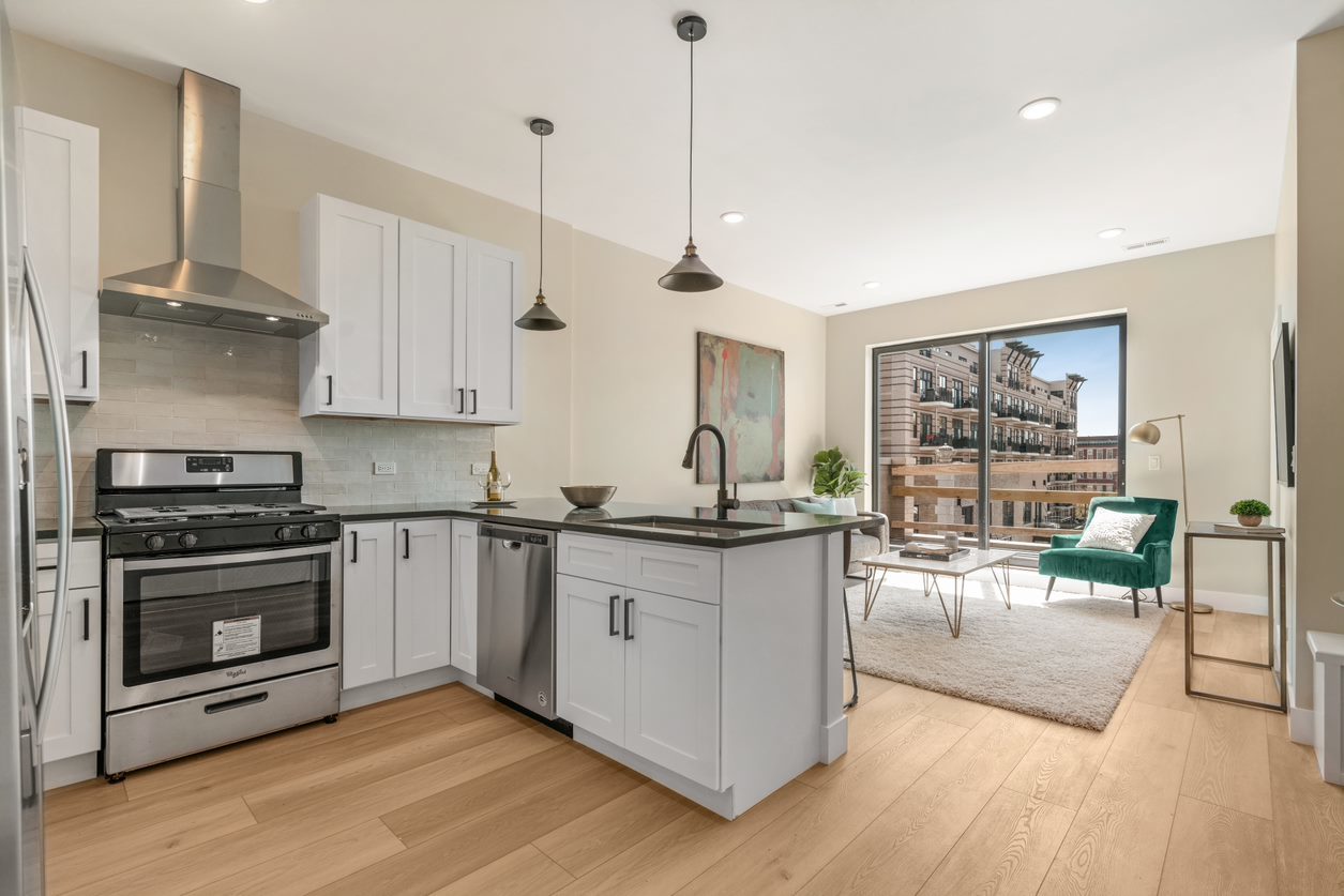 Undisclosed Address Chicago, IL 60657 - Photo 10 of 22 a kitchen with stainless steel appliances granite countertop a stove and a wooden floors