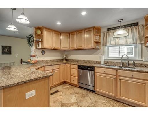108 Chesbrough Road Boston, MA 02132 - Photo 11 of 22 a kitchen with granite countertop a sink stainless steel appliances and cabinets