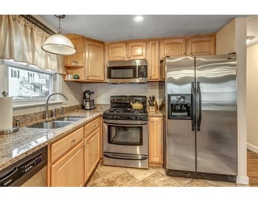108 Chesbrough Road Boston, MA 02132 - Photo 12 of 22 a kitchen with stainless steel appliances granite countertop a stove a sink and a refrigerator