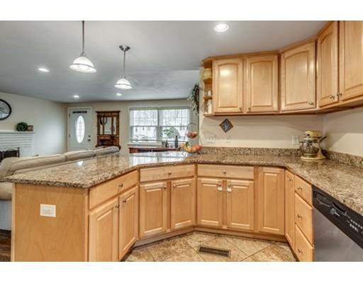 108 Chesbrough Road Boston, MA 02132 - Photo 13 of 22 a kitchen with stainless steel appliances granite countertop a sink stove and cabinets
