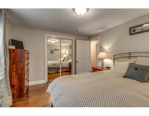 108 Chesbrough Road Boston, MA 02132 - Photo 17 of 22 a bedroom with a bed and wooden floor