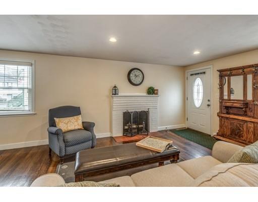 108 Chesbrough Road Boston, MA 02132 - Photo 6 of 22 a living room with furniture and a fireplace