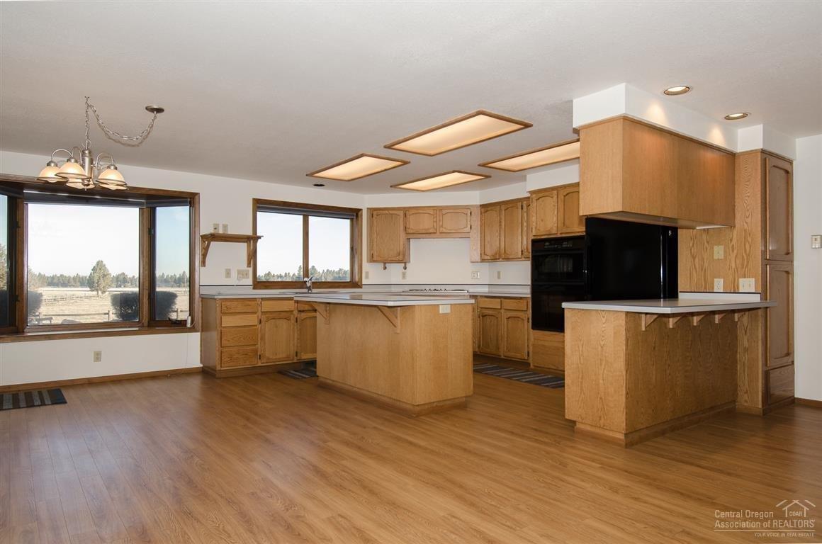 20903 Knott Road Bend, OR 97702 - Photo 9 of 23 a large kitchen with lots of counter space and appliances