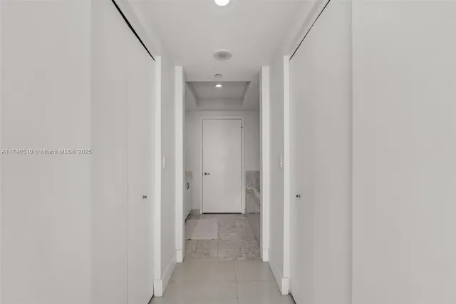 a view of a bathroom from a hallway