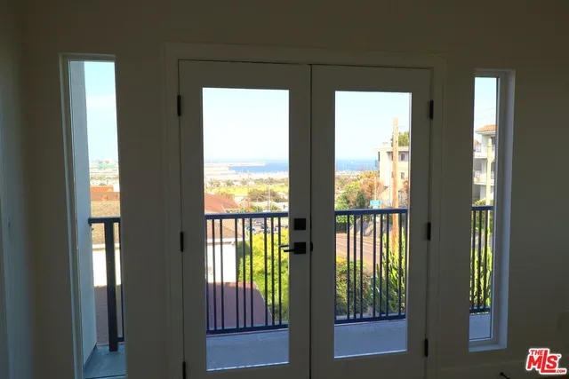 a view of entry way with wooden floor