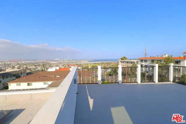 a view of city with ocean