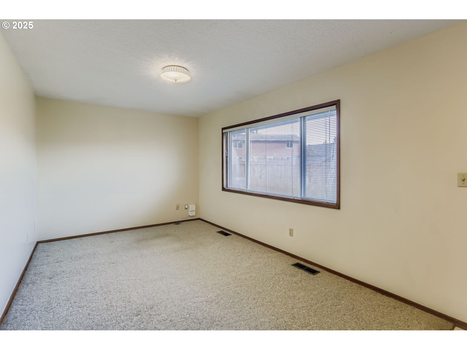 1134 South Ginger Street Cornelius, OR 97113 - Photo 13 of 25 a view of an empty room with a window