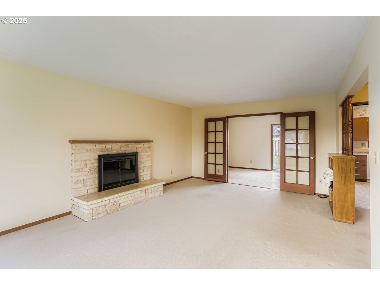 1134 South Ginger Street Cornelius, OR 97113 - Photo 8 of 25 an empty room with furniture and a fireplace