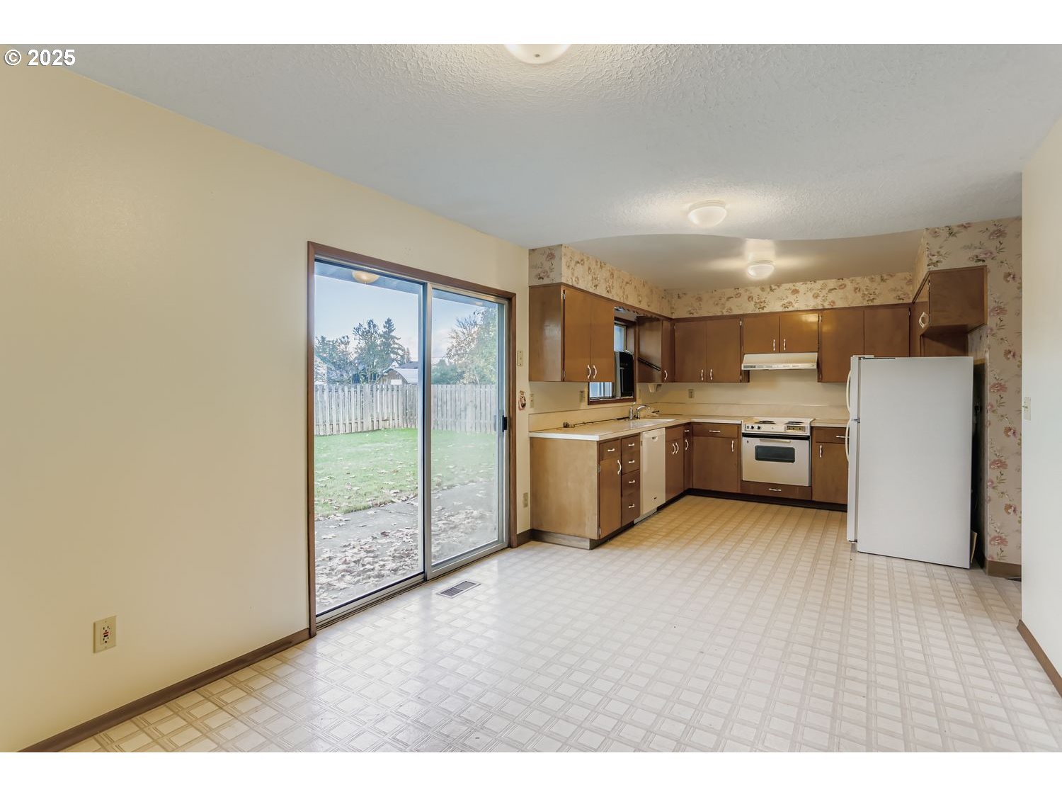 1134 South Ginger Street Cornelius, OR 97113 - Photo 10 of 25 a view of a kitchen with a sink cabinets and a large window