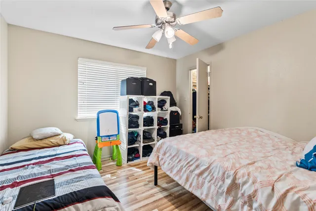 a bedroom with bed and a window