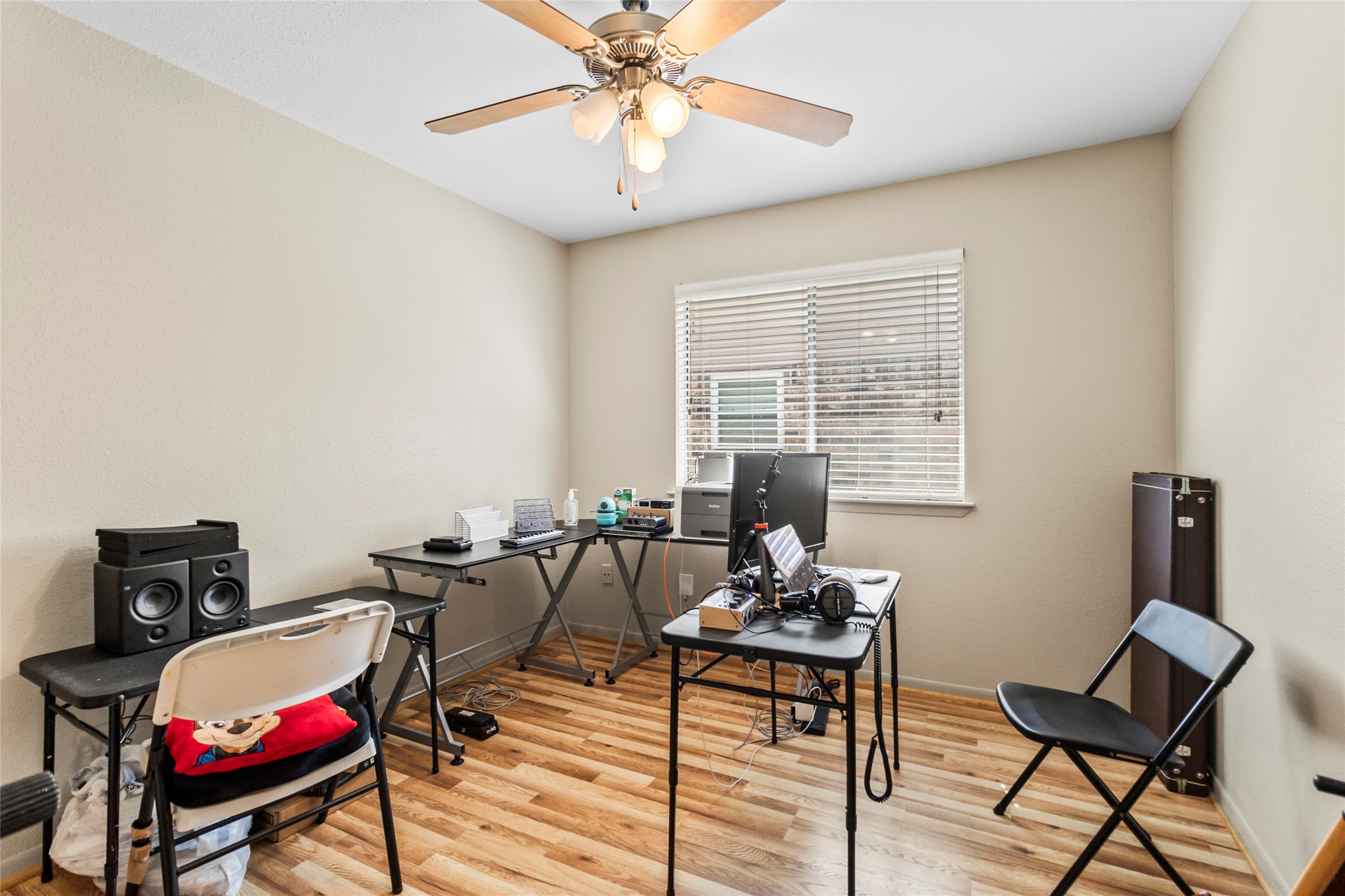 1 East Woodtimber Court Spring, TX 77381 - Photo 13 of 16 a living room with furniture a flat screen tv and a window