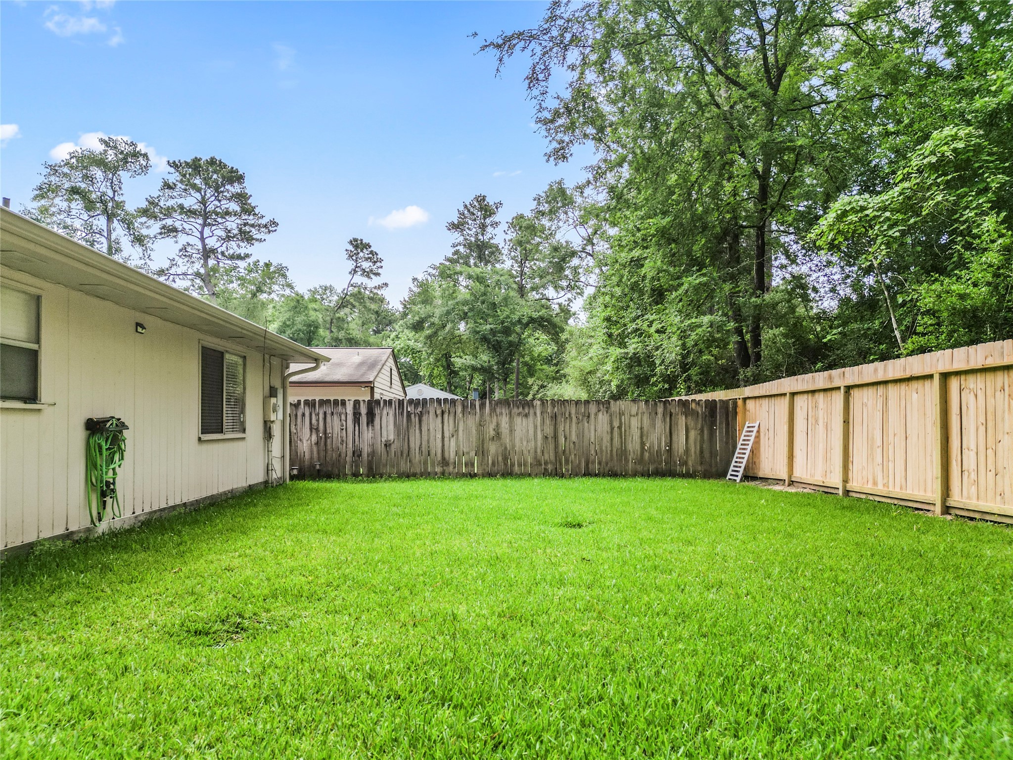 1 East Woodtimber Court Spring, TX 77381 - Photo 15 of 16 a view of a back yard