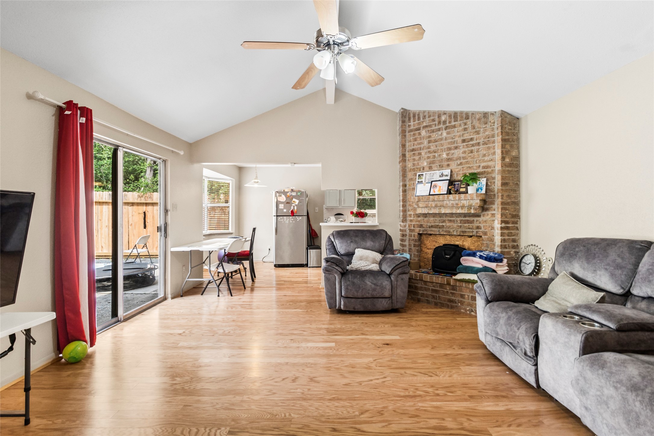 1 East Woodtimber Court Spring, TX 77381 - Photo 2 of 16 a living room with fireplace furniture and a flat screen tv