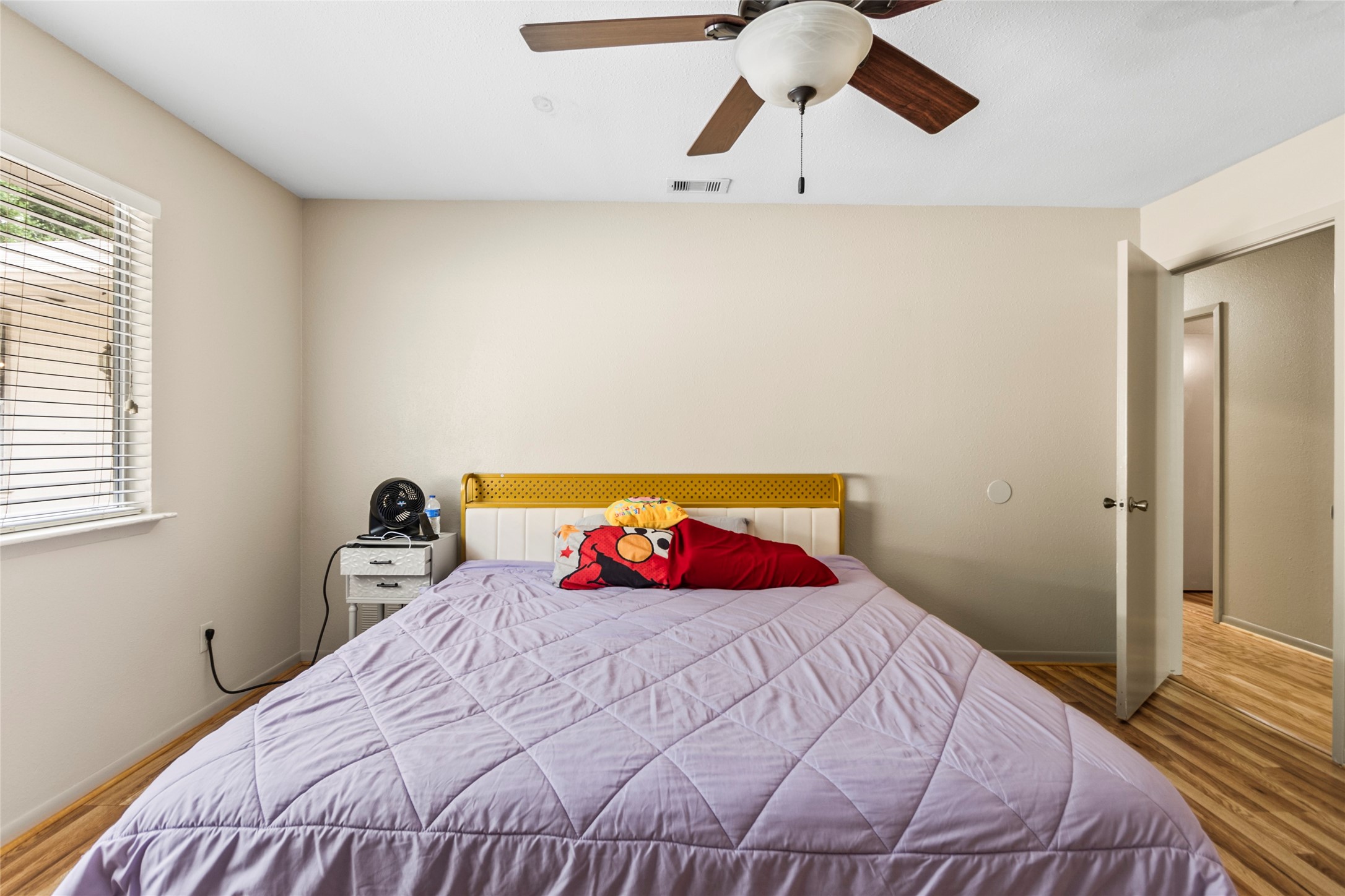 1 East Woodtimber Court Spring, TX 77381 - Photo 9 of 16 a bedroom with a bed and a window