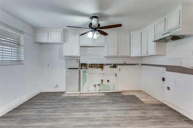 a view of cabinets and wooden floor