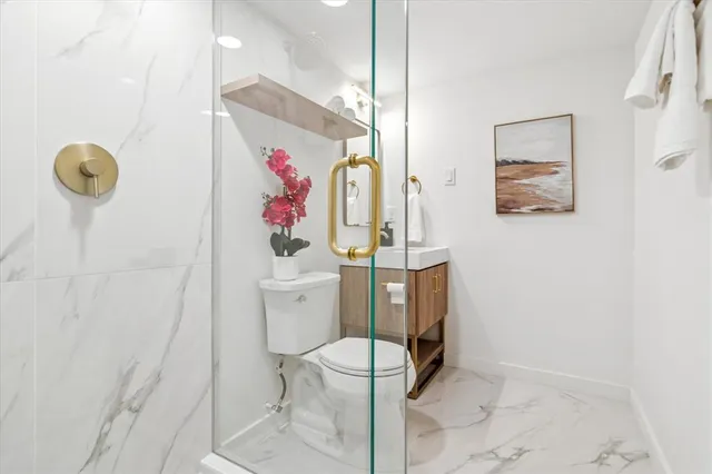 a bathroom with a toilet and sink