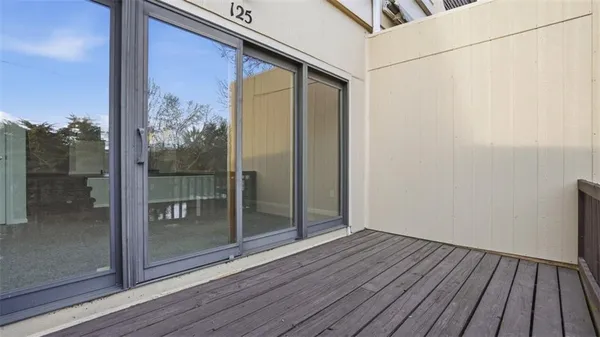 a view of hallway with wooden floor