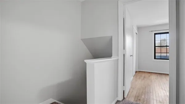 a view of a storage & utility room with wooden floor