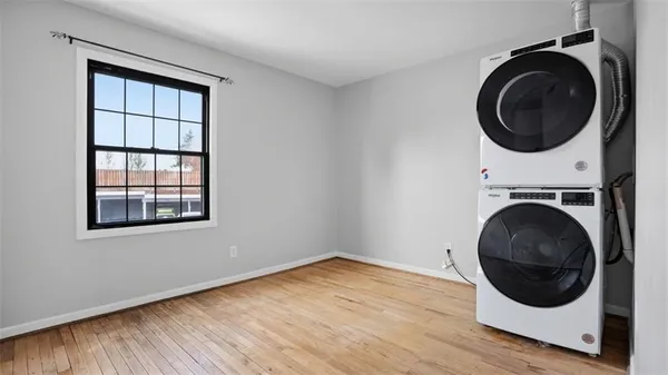 a view of a storage & utility room with wooden floor