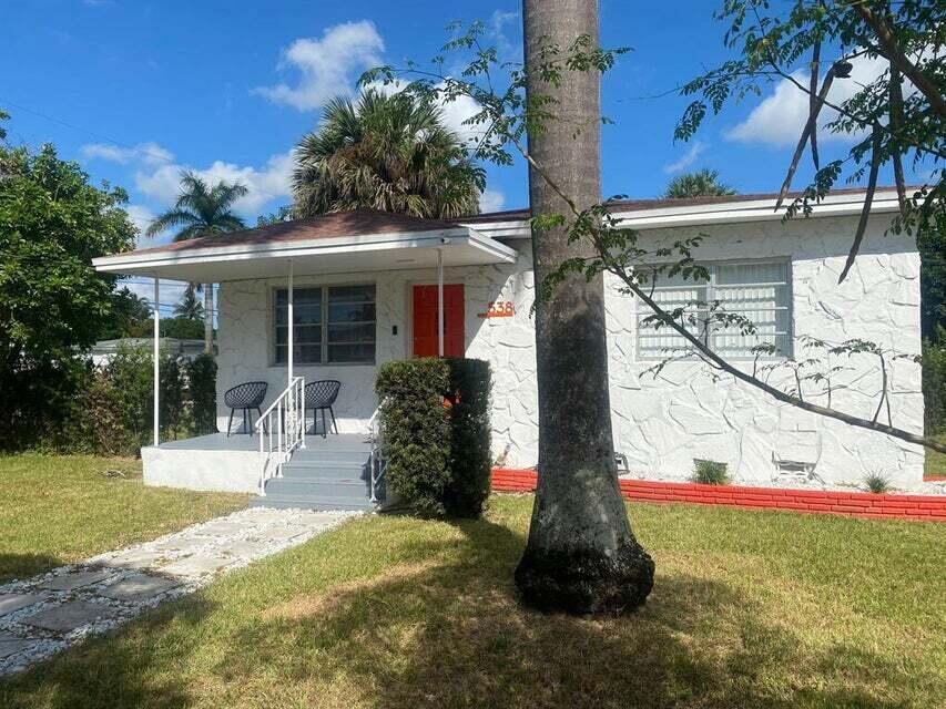 538 Southwest 7th Street Hallandale Beach, FL 33009 - Photo 2 of 17 a front view of house with yard and green space