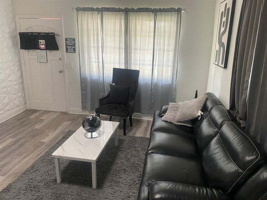 538 Southwest 7th Street Hallandale Beach, FL 33009 - Photo 10 of 17 a living room with furniture and a window