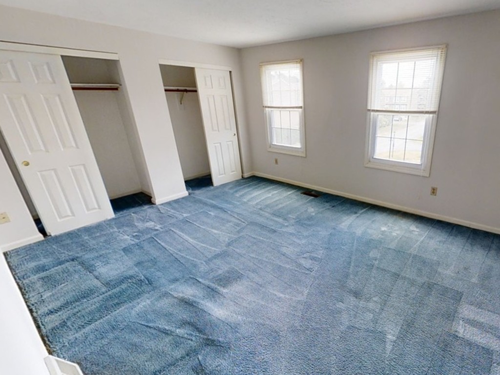 61 Heritage Drive, Unit 61 Tewksbury, MA 01876 - Photo 14 of 35 an empty room with windows