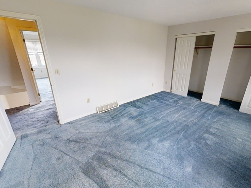 61 Heritage Drive, Unit 61 Tewksbury, MA 01876 - Photo 15 of 35 an empty room with window