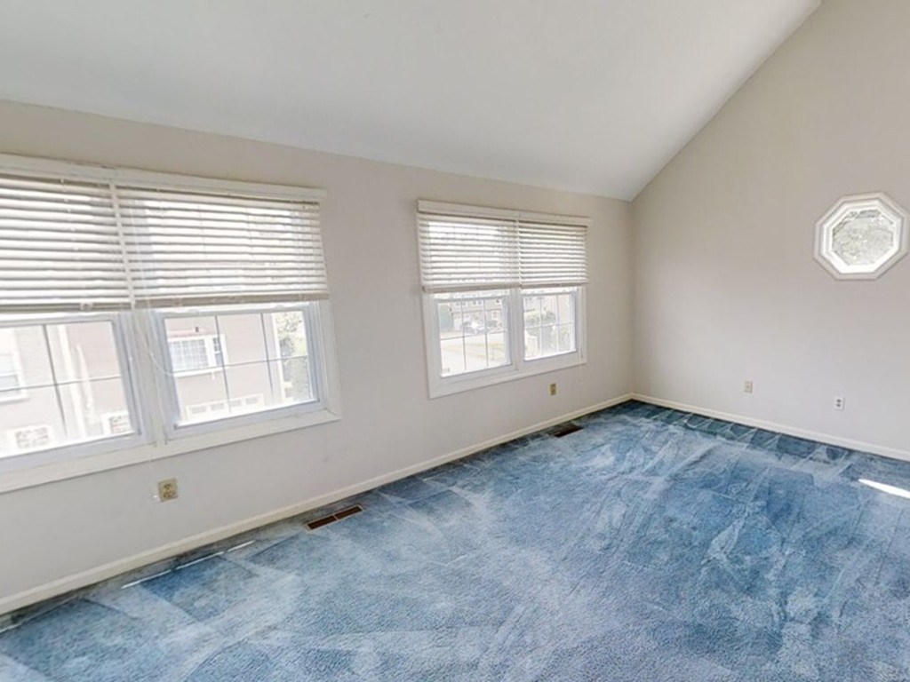61 Heritage Drive, Unit 61 Tewksbury, MA 01876 - Photo 17 of 35 an empty room with a window