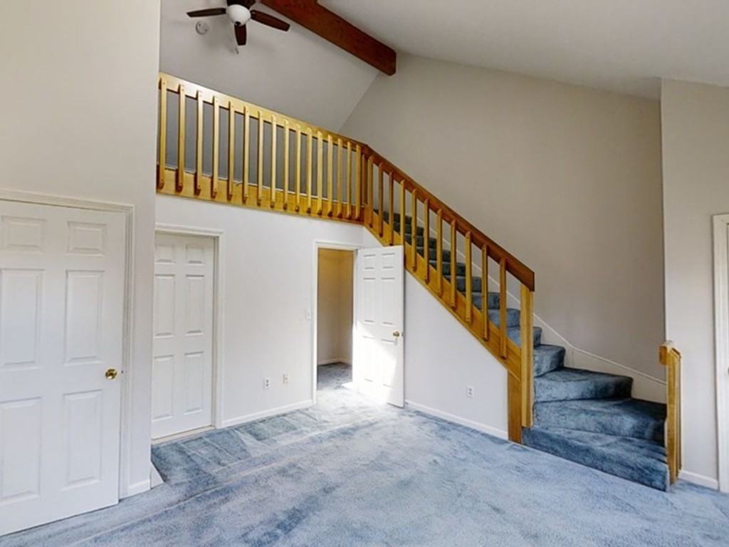 61 Heritage Drive, Unit 61 Tewksbury, MA 01876 - Photo 18 of 35 a view of staircase with white walls and a window