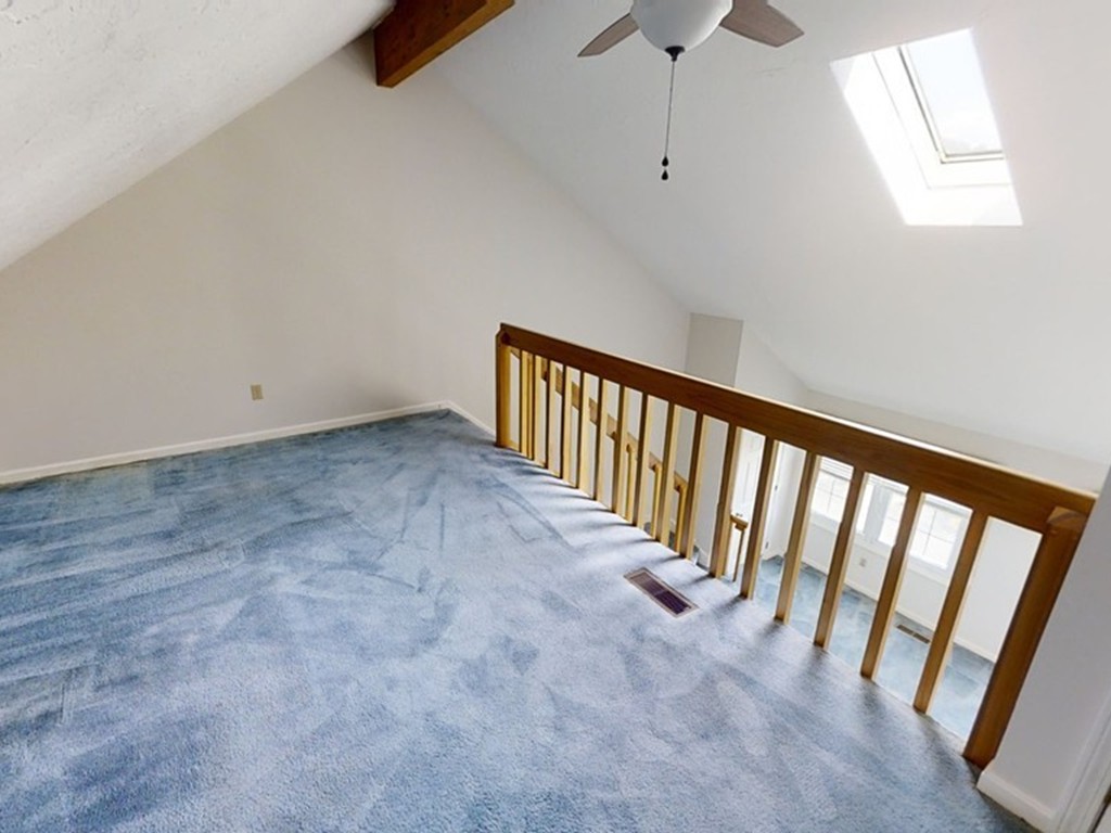 61 Heritage Drive, Unit 61 Tewksbury, MA 01876 - Photo 21 of 35 a view of a hallway with a window